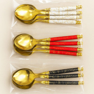 4 Pcs golden dessert spoons with colored handles.